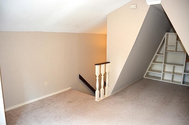 bonus room featuring carpet and lofted ceiling