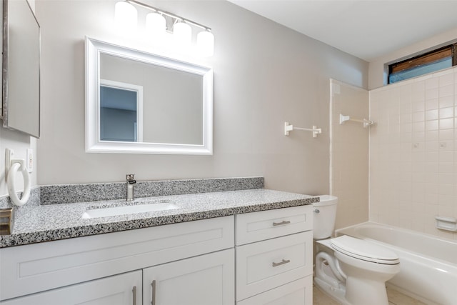 bathroom featuring toilet, shower / tub combination, and vanity