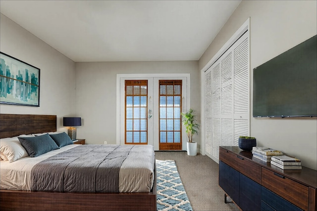 bedroom with light carpet and french doors