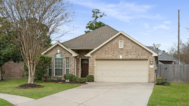 view of front of house with a garage and a front lawn