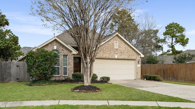 view of front of property featuring a front lawn and a garage