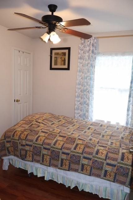 bedroom with hardwood / wood-style flooring and ceiling fan