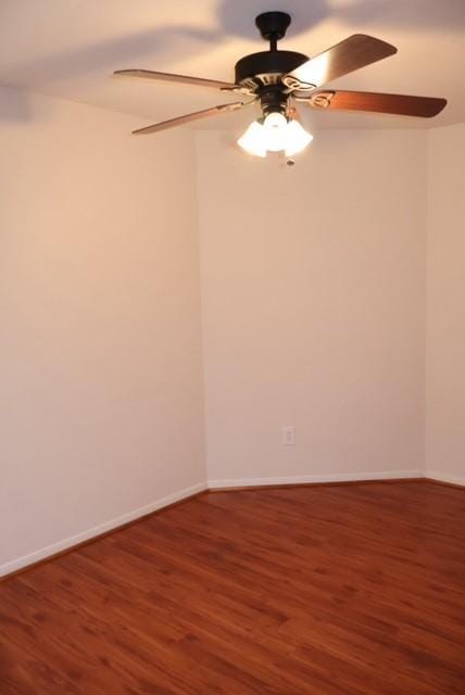 empty room with dark wood-type flooring