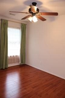 spare room with dark hardwood / wood-style flooring