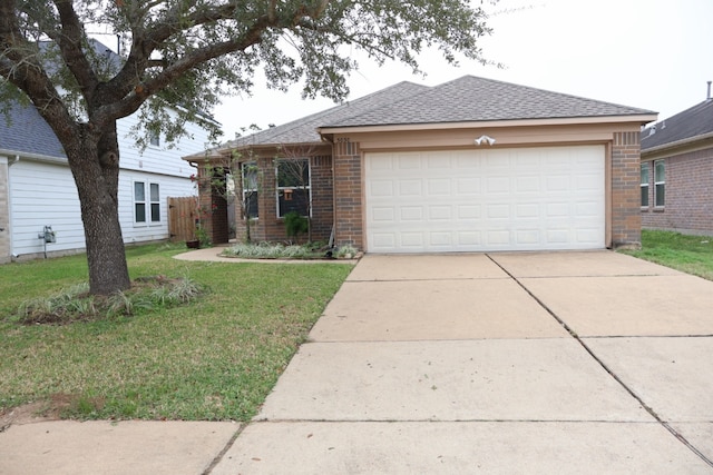 view of front of house featuring a garage and a front yard