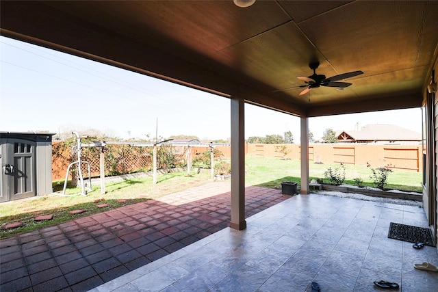 view of patio / terrace featuring ceiling fan and a shed