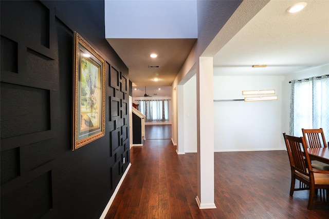 corridor featuring dark hardwood / wood-style floors