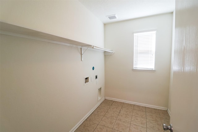 laundry area with light tile patterned floors, hookup for a washing machine, and electric dryer hookup