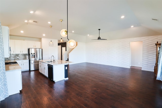 kitchen with white cabinetry, stainless steel fridge, a kitchen island with sink, dishwasher, and hanging light fixtures