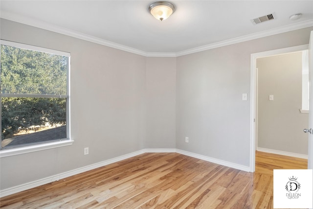 unfurnished room with crown molding and light hardwood / wood-style floors