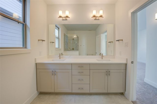 bathroom featuring walk in shower and vanity