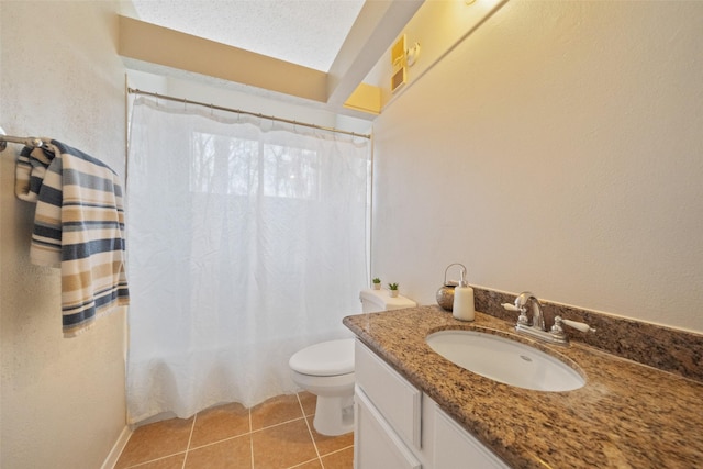 bathroom with toilet, vanity, a shower with curtain, and tile patterned floors