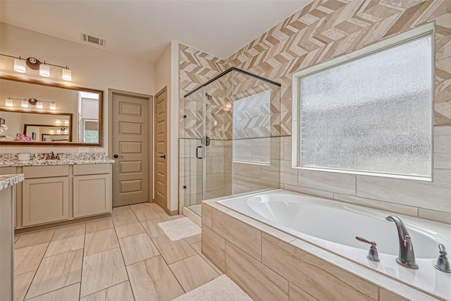 bathroom featuring vanity, tile patterned floors, and independent shower and bath