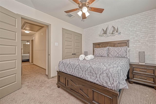 bedroom with ceiling fan and light colored carpet