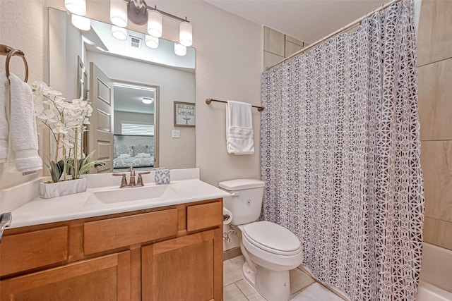 full bathroom with tile patterned floors, toilet, vanity, and shower / bathtub combination with curtain