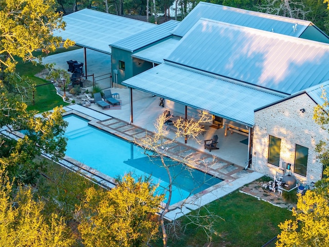 exterior space featuring a patio area and outdoor lounge area