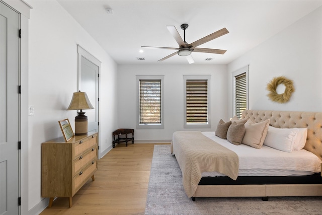 bedroom with ceiling fan and light wood-type flooring