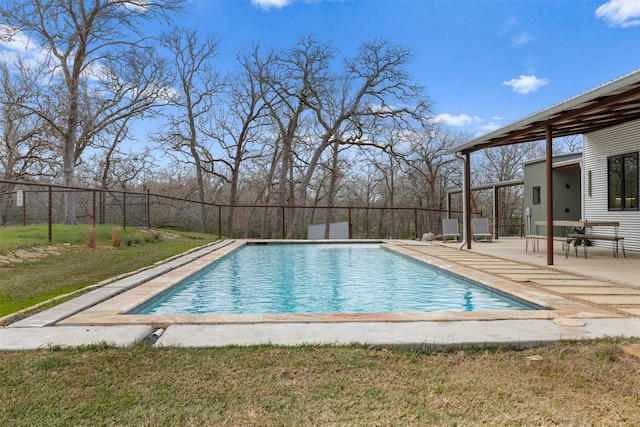 view of swimming pool featuring a yard and a patio