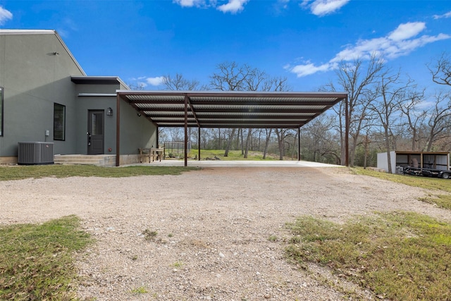 view of parking / parking lot featuring a carport