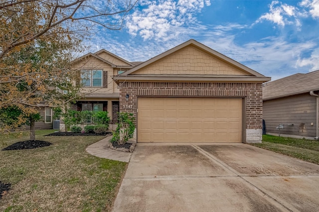 view of front of property with a garage and a front yard