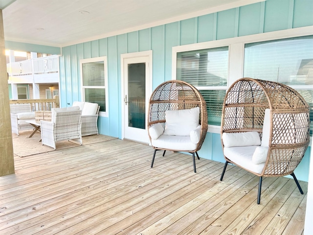 wooden deck with an outdoor living space