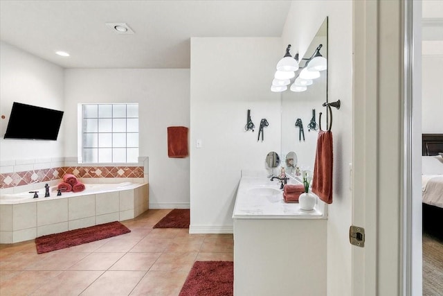 bathroom featuring vanity, tile patterned flooring, and a relaxing tiled tub