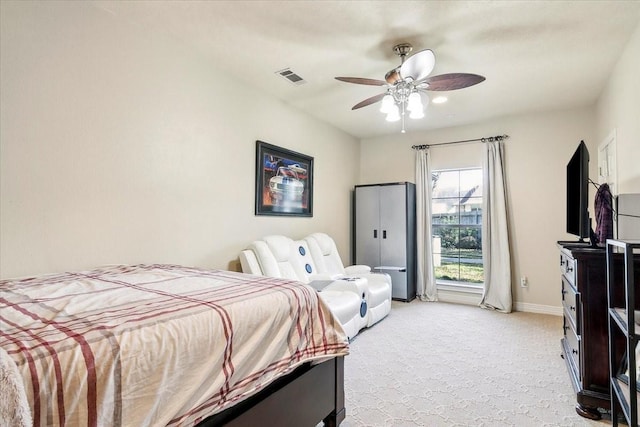 bedroom with ceiling fan and light colored carpet