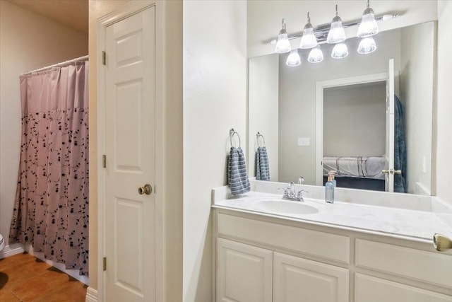 bathroom with walk in shower, tile patterned floors, and vanity