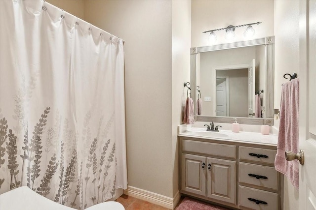 bathroom featuring tile patterned flooring and vanity