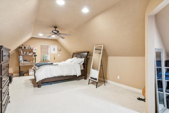 carpeted bedroom with ceiling fan and lofted ceiling