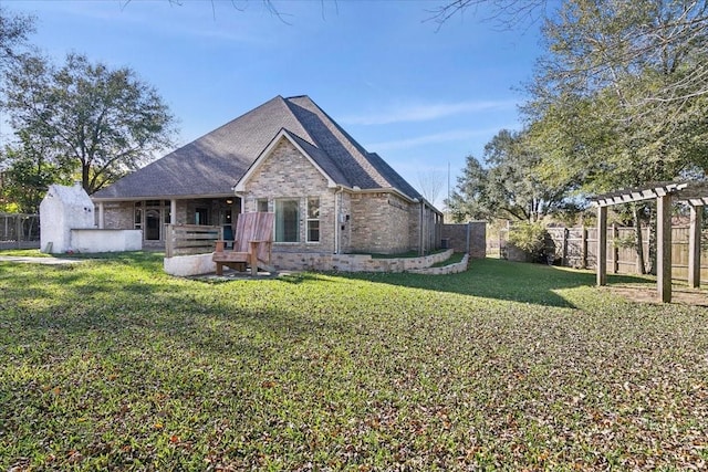 exterior space with a front yard and a pergola