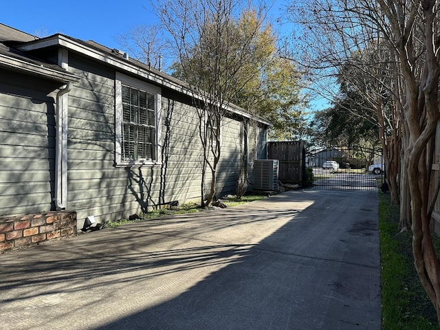 view of side of property with central air condition unit