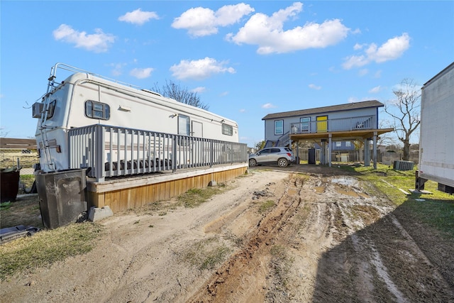 rear view of property featuring central air condition unit