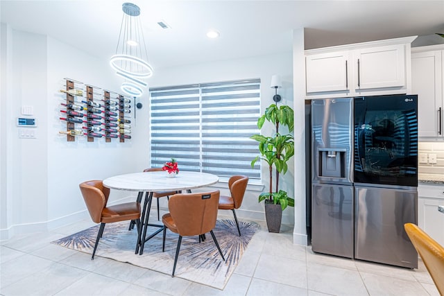 dining space with light tile patterned floors