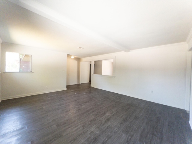 empty room with dark wood-type flooring and beam ceiling