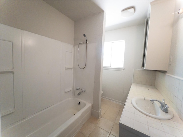 full bathroom featuring toilet, tasteful backsplash, shower / bathing tub combination, tile patterned floors, and vanity