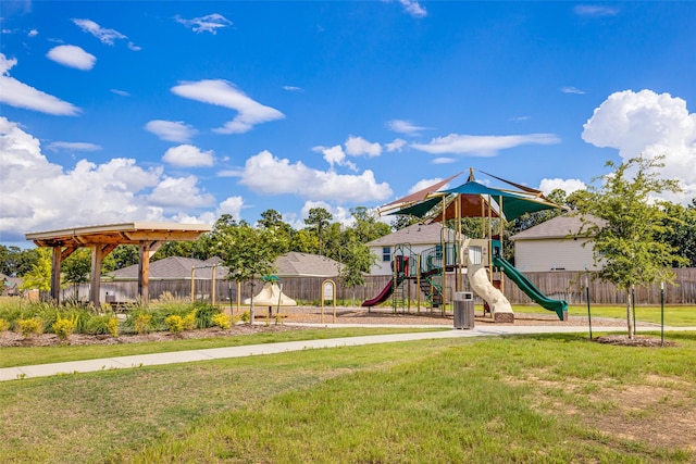 view of jungle gym featuring a lawn