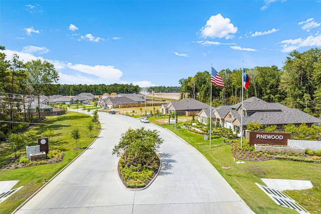 view of community featuring a lawn