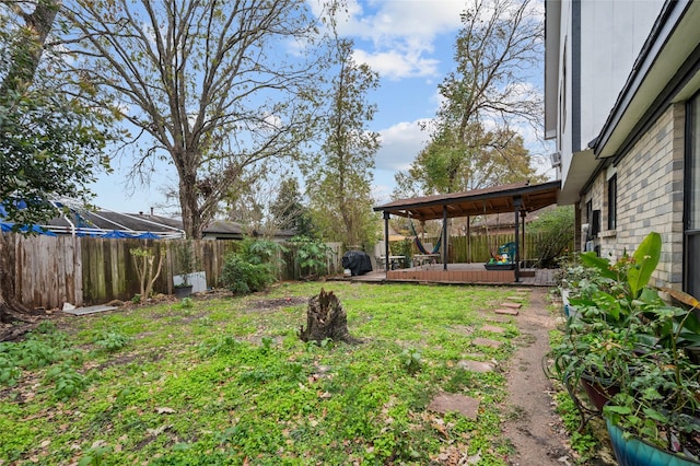 view of yard featuring a wooden deck