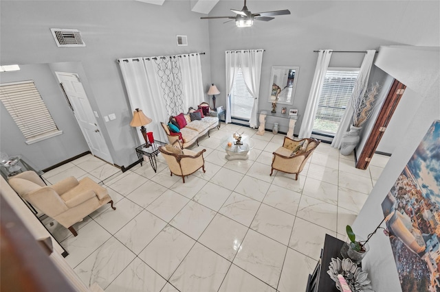 unfurnished living room featuring ceiling fan