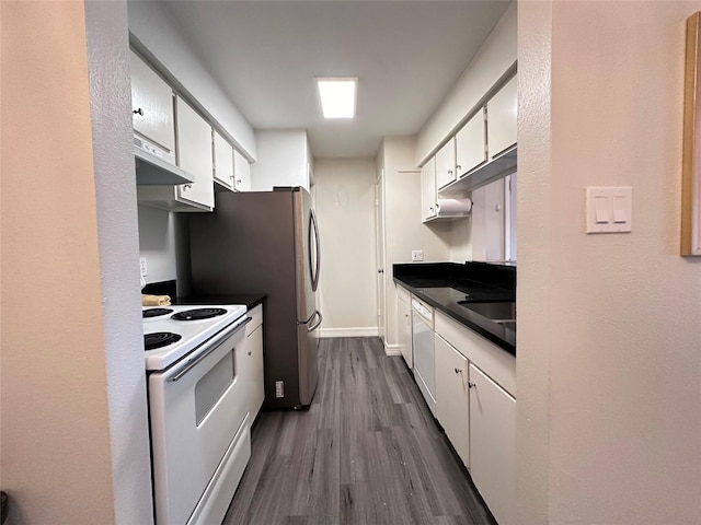 kitchen with white cabinets, dark wood-type flooring, sink, and white appliances