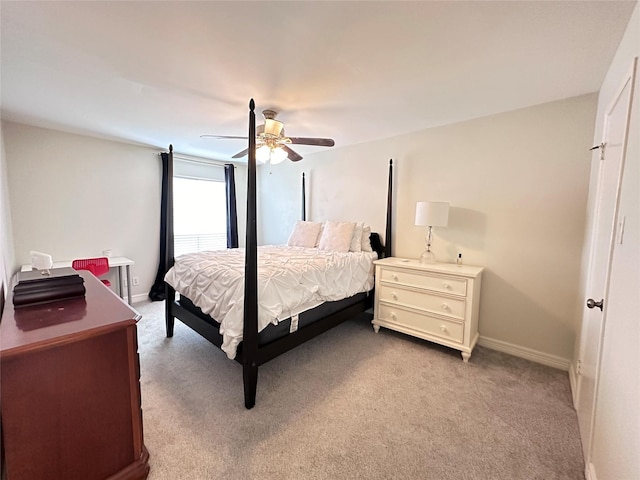 bedroom with ceiling fan and light colored carpet