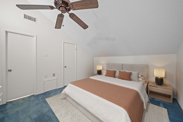 carpeted bedroom featuring ceiling fan, a textured ceiling, and lofted ceiling