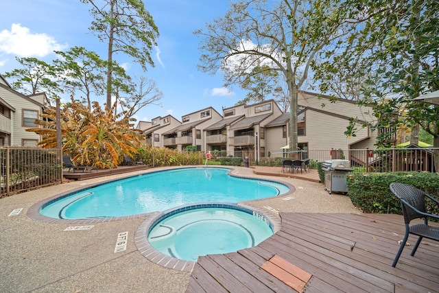 view of pool featuring an in ground hot tub and area for grilling