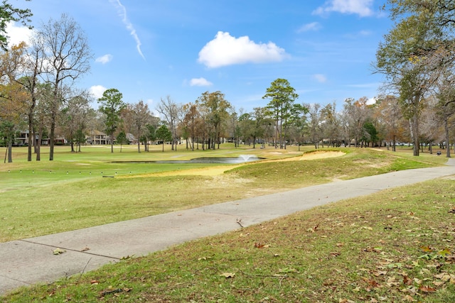 view of property's community featuring a lawn