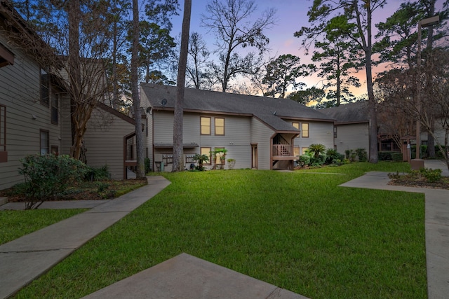 view of front of house with a yard