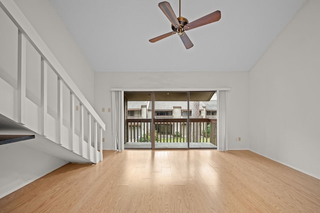 unfurnished living room featuring ceiling fan and light hardwood / wood-style flooring