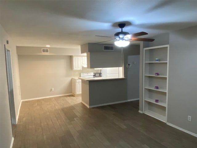 kitchen featuring kitchen peninsula, hardwood / wood-style floors, white cabinets, and ceiling fan