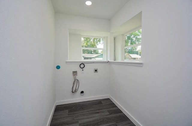 clothes washing area with dark wood-type flooring, washer hookup, gas dryer hookup, and electric dryer hookup