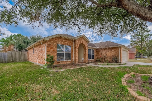 single story home with a front lawn and a garage